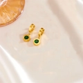 Detail of gold roman numeral earrings with green gemstone on elegant silk background - Green Rhinestone Roman Earrings