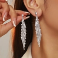 Sparkling long tassel rhinestone earrings in silver finish on a female model - Silver Rhinestone Tassel Long Style (DTE1616868S-W)