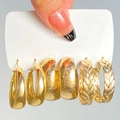 Three pairs of gold hoop earrings with smooth, hammered, and twisted textures - 15 KC Gold (8749)