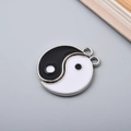 Detail showing high-gloss enamel Yin Yang Tai Chi charm with polished metal base - Silver Edge Tai Chi
