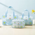Three-piece transparent blue PVC wash bag set with daisy print and tulip details - Blue Daisy (3-Piece Set)