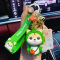 Cute Shiba Inu keychain featuring a green apple costume and a Fortune Shiba wrist strap - Zodiac Snake Shiba Inu
