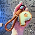 Letter P leather keychain with brown and mint green stitch design and woven lanyard - Letter P