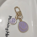 Golden alloy keychain with purple enamel smiley face pendant for bags and accessories - Small & Large Set Purple