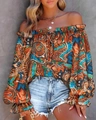 Detail of bohemian off-shoulder blouse with ethnic print and flared lantern sleeves - Ethnic Patchwork