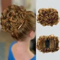 Detail of curly synthetic hair bun with internal comb and elastic net in golden brown - 27# (Strawberry Blonde)