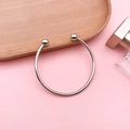 Minimalist silver beaded open bangle with spherical ends on a modern wood tray - Open Round Bangle (Inner Diameter 59mm)