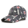Détail de l'imprimé graffiti drapeau britannique sur la surface en coton de la casquette - Taille unique / Noir
