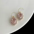 Pink oval zircon earrings with halo diamonds and golden spiral hooks for women - French Oval Pink Zircon