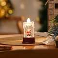 Kaars rode kerstman met zak (watergevuld)