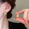 Detail of gold snake pattern hoop earrings with white zircon stones on model's ear - 49# Ear Buckle - Gold Snake Skin Pattern With Zircon