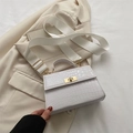 White croc-embossed crossbody bag with gold twist lock and a wide white nylon strap - White