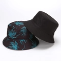 Reversible bucket hat set with solid black and tropical palm tree print for sun protection - Blue Black Leaves