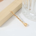 Elegant gold-plated metal bobby pin featuring a twisted texture and round base detail - No. 02 Bobby Pin (Twist Dot)