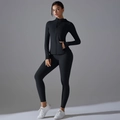 Detail of black hooded zip-up sports jacket with thumb holes and high waist yoga leggings - S / Black