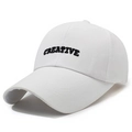 White cotton baseball cap featuring black CREATIVE embroidery for a modern minimalist style - Adjustable / White