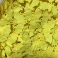 Macro shot of bulk yellow plastic Halloween bat decorations with detailed textures - Yellow