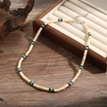 Bohemian choker necklace with turquoise and coconut wood beads on a dark wood background - Beige/Brown/Turquoise Wood (ZJ11064)