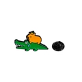 Cute Capybara riding green crocodile enamel pin badge with an orange fruit on head - Riding Crocodile
