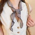 Detail of taupe paisley long silk scarf with intricate dark blue patterns and wavy edges - Grey Paisley Slim Scarf