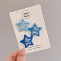 Three-piece set of blue gradient star-shaped metal hair clips on a display card - Blue