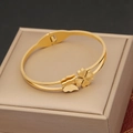 Detail of golden stainless steel bracelet with butterfly and clover charms on a gift box - Butterfly & Clover Charm Style (5#)