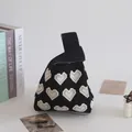 Knitted wrist bucket bag with white heart pattern on black background for women - Black Grey Heart