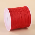Rouleau de cordon en nylon rouge 0,8 mm pour bijoux sur une bobine en plastique - 0,8 mm x 50 m / Rouge