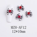 Macro view of vintage heart alloy nail art charms with red gemstones, size 12x10mm - Red Heart Bow Knot (AF12)