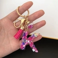 Detail of pink resin letter K keychain with glitter ball and stylish silk tassel - Small Ball Tassel Clasp / Letter K