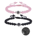 Macro detail of projection beads showing 100 languages I Love You on couple bracelets - Rose Quartz + Lava Stone