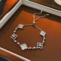 Detail of clover bracelet featuring shell inlay and cubic zirconia on a sliding chain - 10# Bracelet-Silver-MOP Texture Clover Style