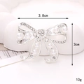 Macro detail of silver bow shoe charm with pearls and rhinestones 3.8cm wide - D2473 38mm*30mm Silver Ribbon Pearl Bowknot