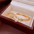 Λεπτομέρεια από επιχρυσωμένο βραχιόλι 18K σε σχήμα κολοκύθας με ένθετες πέτρες ζιργκόν - Επιχρυσωμένο 18Κ / Χρυσό