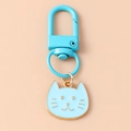 Detail of light blue cartoon cat keychain with golden edges and lobster clasp - Blue Cat Head Style