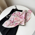 Detail of pleated satin scarf featuring vibrant paisley floral patterns and soft texture - Rose Cashew