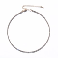 Close-up of gold-plated tennis necklace with lobster clasp and adjustable extension chain - White Rhinestone (Gold Plated)