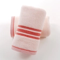 Light pink cotton towel set featuring subtle orange horizontal stripes and plush looped texture - Soft Intent Pink Towel