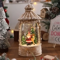 Dettaglio lanterna di Natale vintage con Babbo Natale, renne ed effetto neve glitterata - Babbo Natale e Renna
