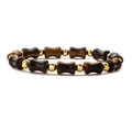 Pulsera de cuentas de ojo de tigre con segmentos de bambú dorados en fondo blanco - Pulsera de piedra ojo de tigre