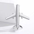 Polished silver airplane brooch pin for shirts displayed on a white minimalist pedestal - Silver