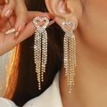 Golden heart-shaped tassel earrings featuring sparkling white zircons on model - Gold Heart Multi-Row Tassel Style (DTE1617114GL-W)