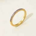 Macro detail of gold-plated stainless steel ring with elegant purple zircon row setting - US 6 / Purple