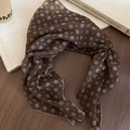 Detail of vintage floral dot silk scarf with delicate hem edge on wooden background - Brown Headscarf Style 1