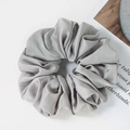 Detailed view of large silver-grey satin hair scrunchie with soft pleated texture - Silver Grey(G)