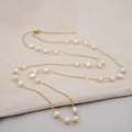 Elegant gold chain layered necklace with white freshwater pearls on beige fabric - 5MM Baroque Starry Style