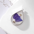 Teardrop resin pendant with purple dried flower petals and gold foil in silver frame - Purple Leaf Teardrop