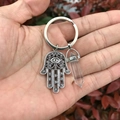 Hamsa Hand keychain with clear natural crystal hexagonal pillar and evil eye charm - Clear White
