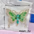 Golden butterfly brooch with green enamel wings and turquoise rhinestones in packaging - Gold Green Diamond Butterfly