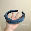 Detail of dark blue denim headband featuring twisted fabric and gold chain link accents - Blue Denim Gold Chain Twist Headband